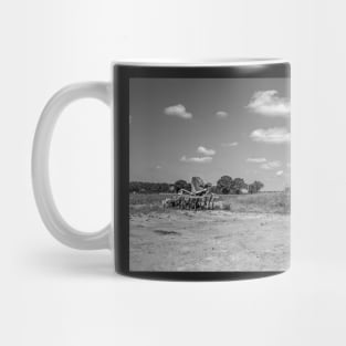 Plough on the side of an arable field in the Norfolk countryside Mug